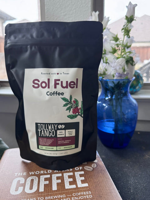 Sol Fuel coffee bag on a surface with a window and vase in the background